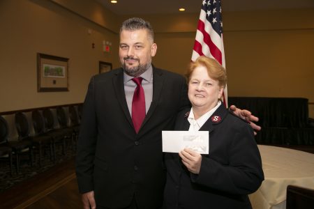 Event Supervisor with Arm around Salvation Army Representative